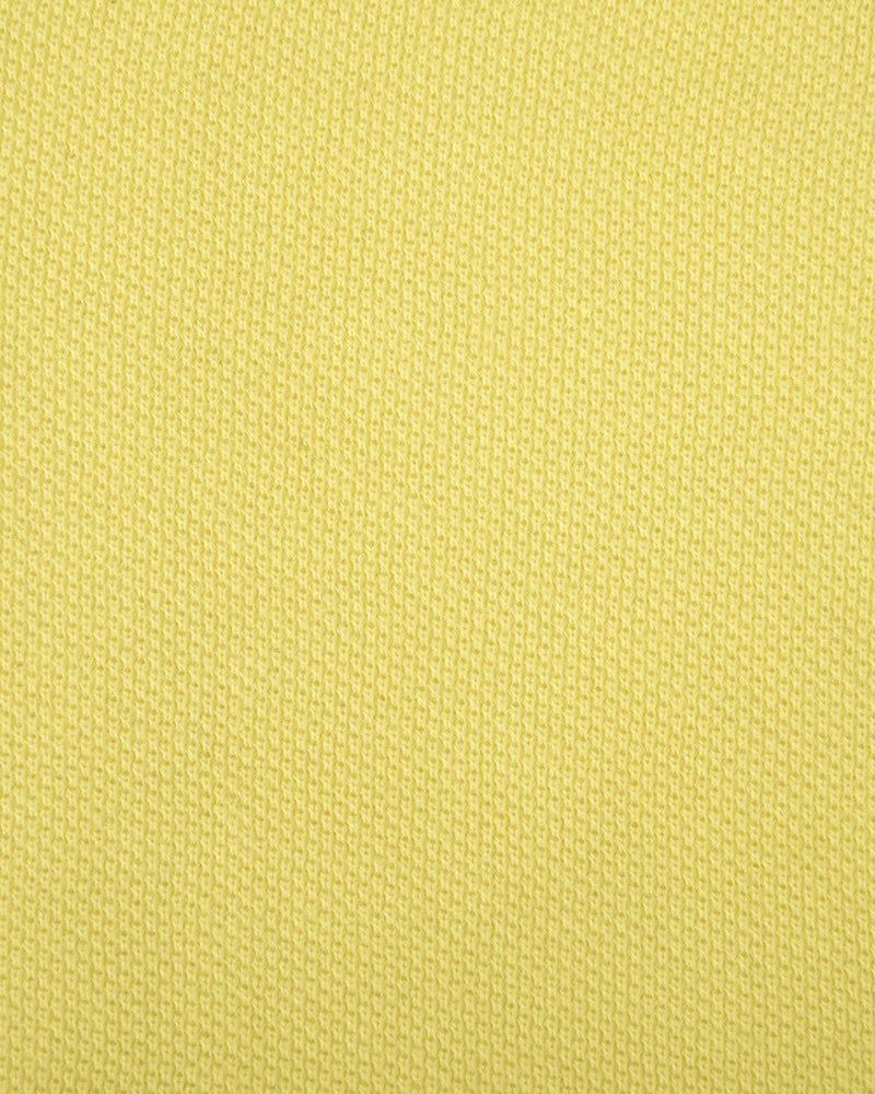 Close up of the custom oxford polo shirt for men by Luxire in mid yellow