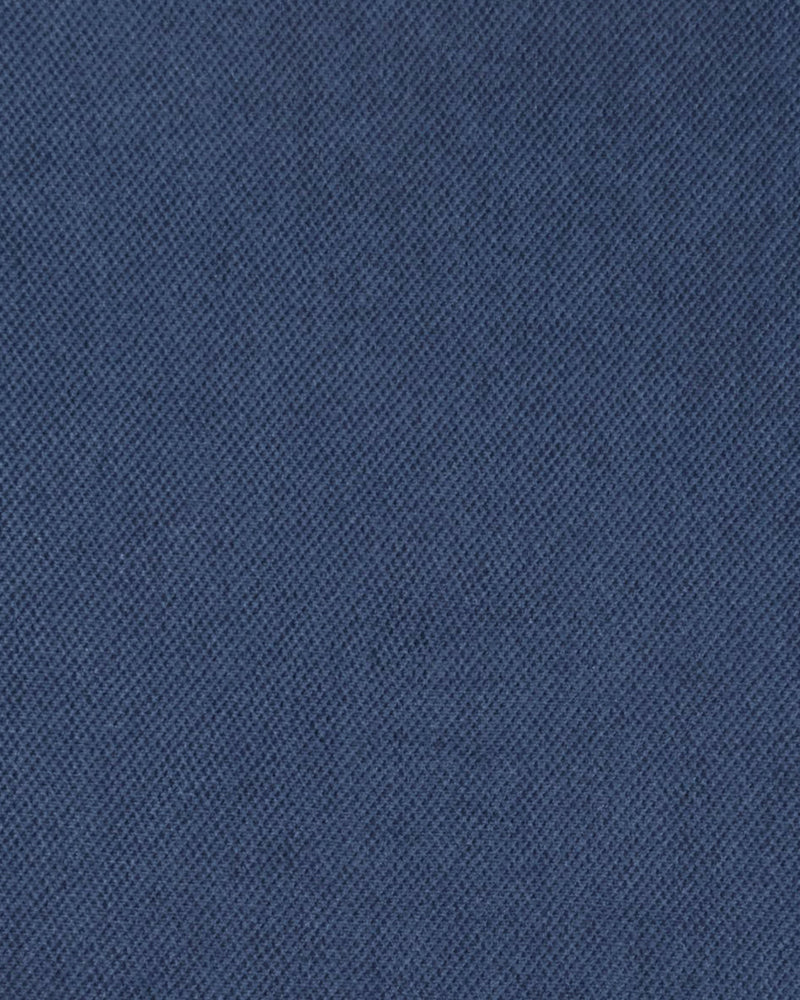 Close up of the custom oxford polo shirt for men by Luxire in washed indigo