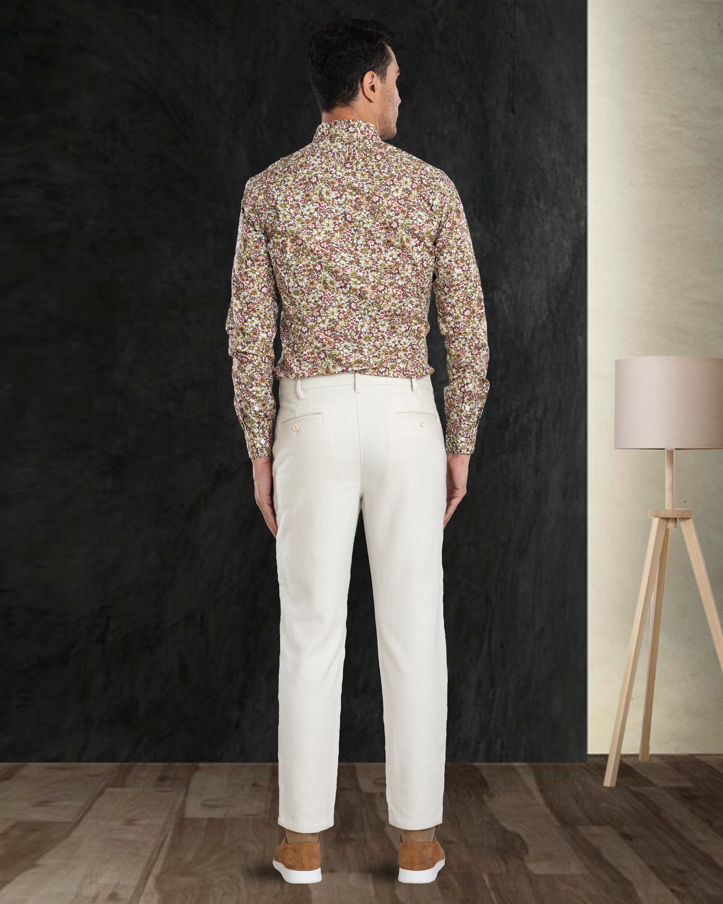 Back view of model  wearing custom wool Chino pants for men by Luxire in cream