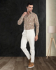 Front view of model  wearing custom wool Chino pants for men by Luxire in cream