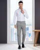 Model wearing custom wool Chino pants for men by Luxire in grey hand on chest