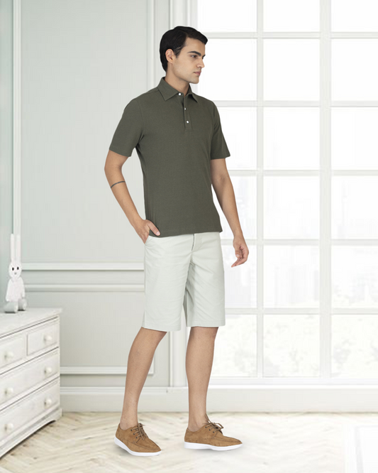Model wearing custom Genoa shorts for men by Luxire in pale green