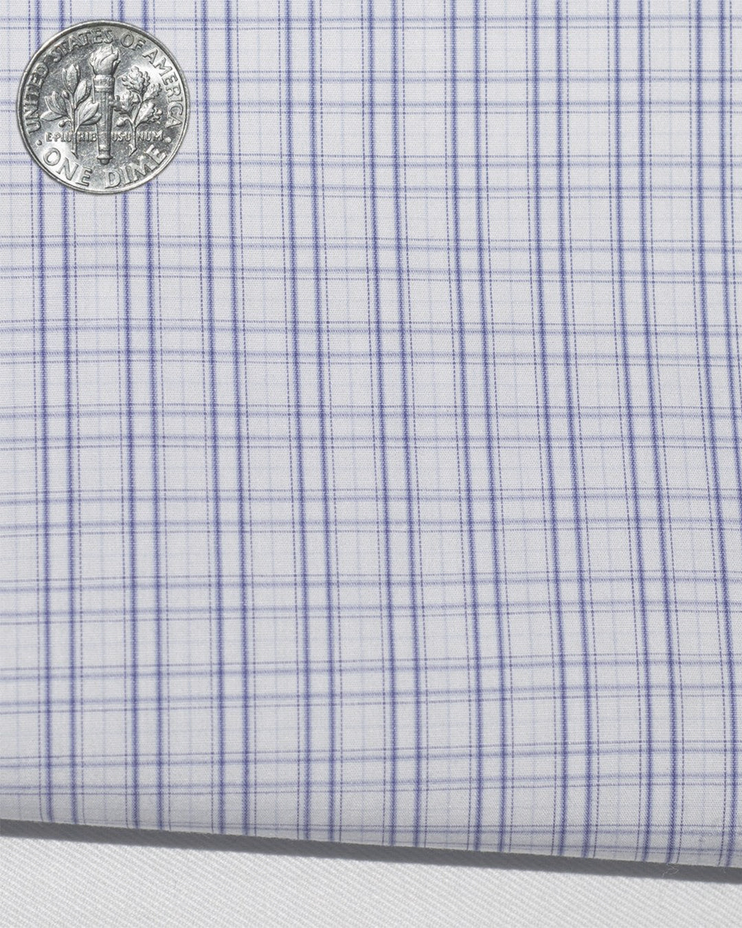 Closeup view of custom check shirts for men by Luxire in blue shadow