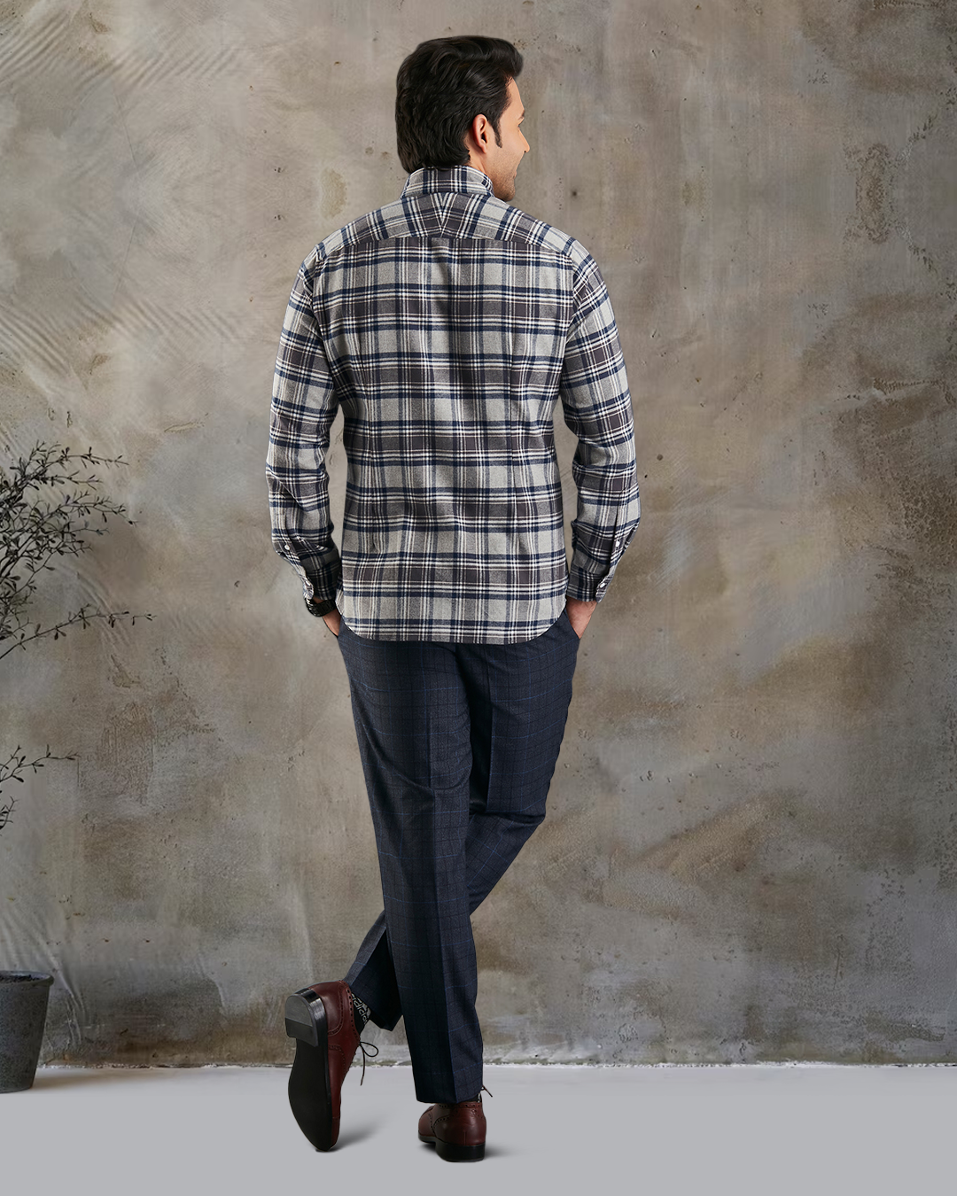 Back of model wearing custom check shirts for men by Luxire dark grey and navy