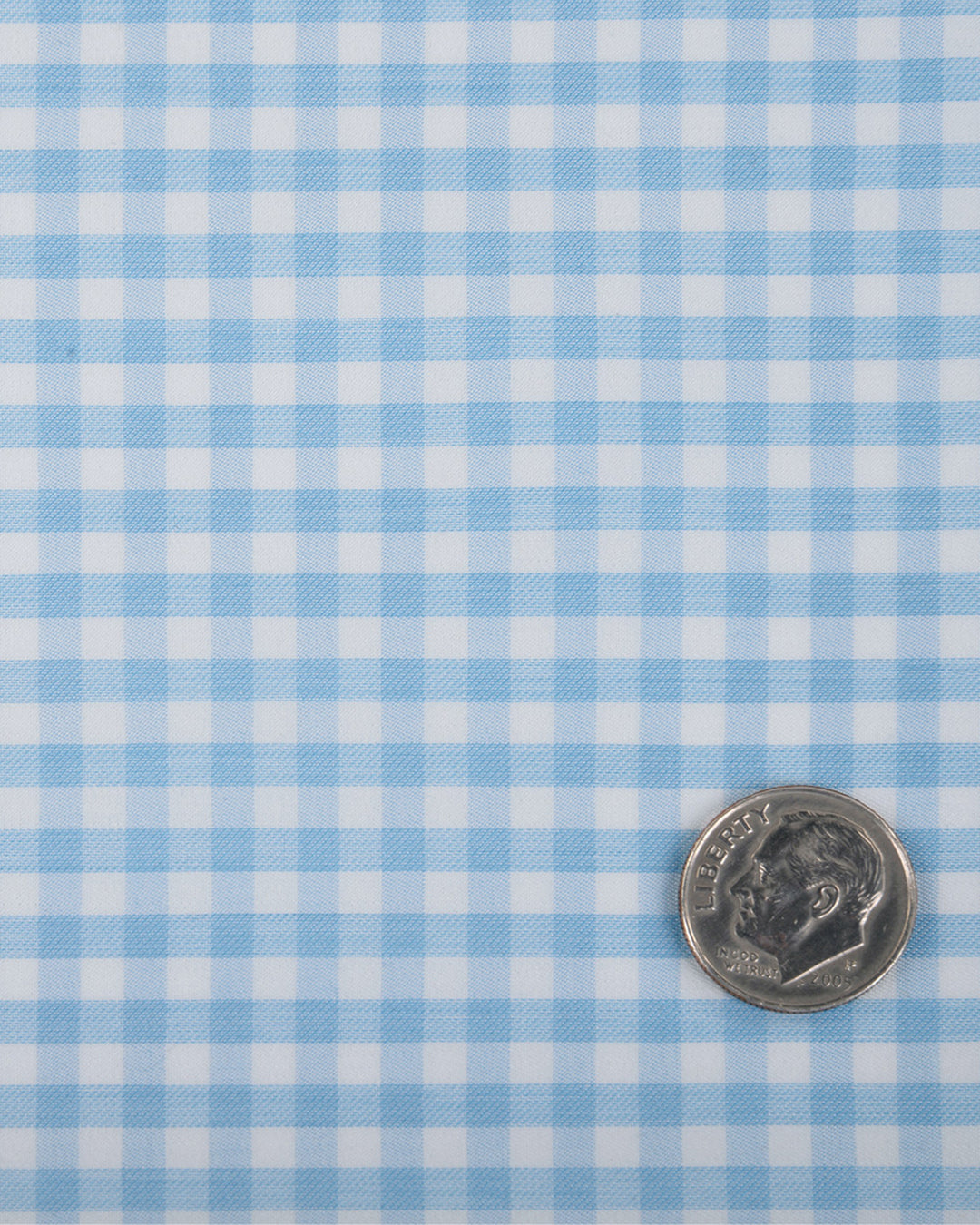 Close up view of custom check shirts for men by Luxire light blue gingham