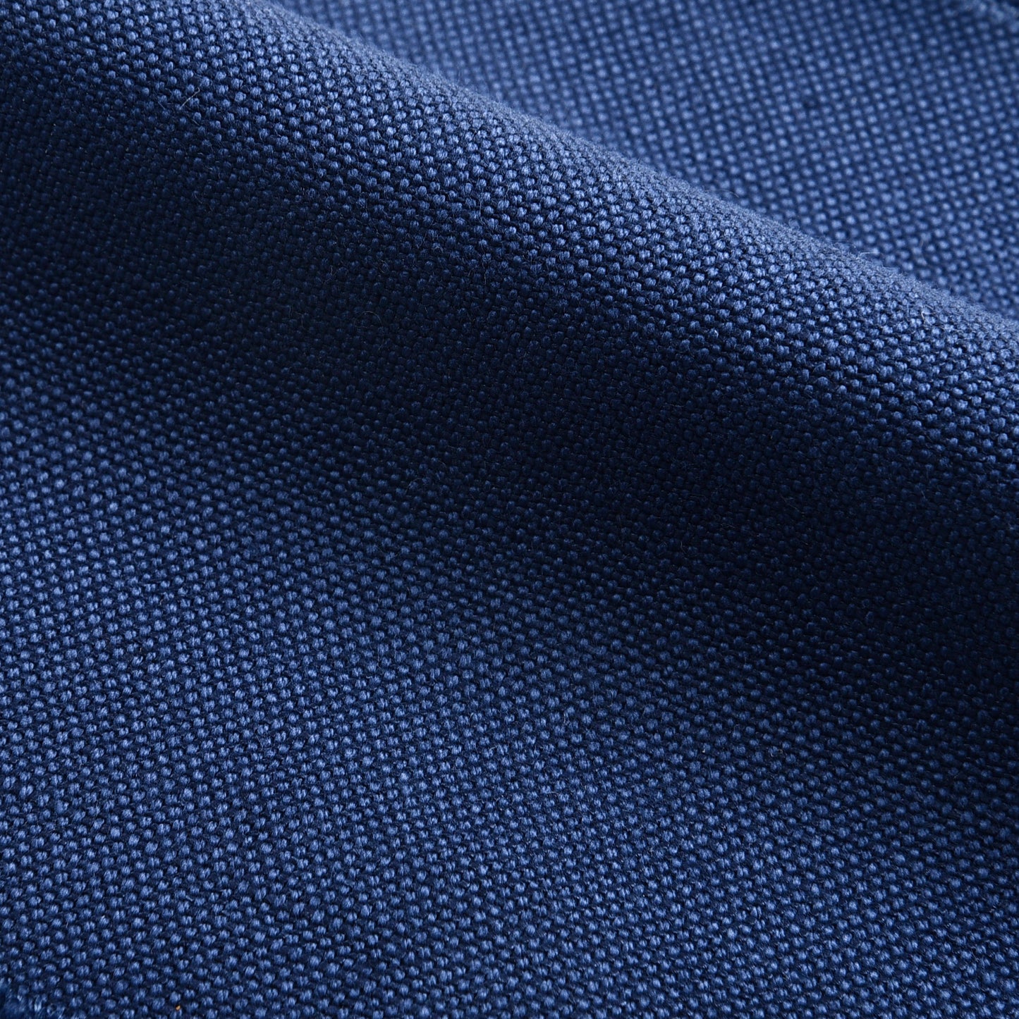 Close up view of custom linen canvas pants for men by Luxire in indigo blue