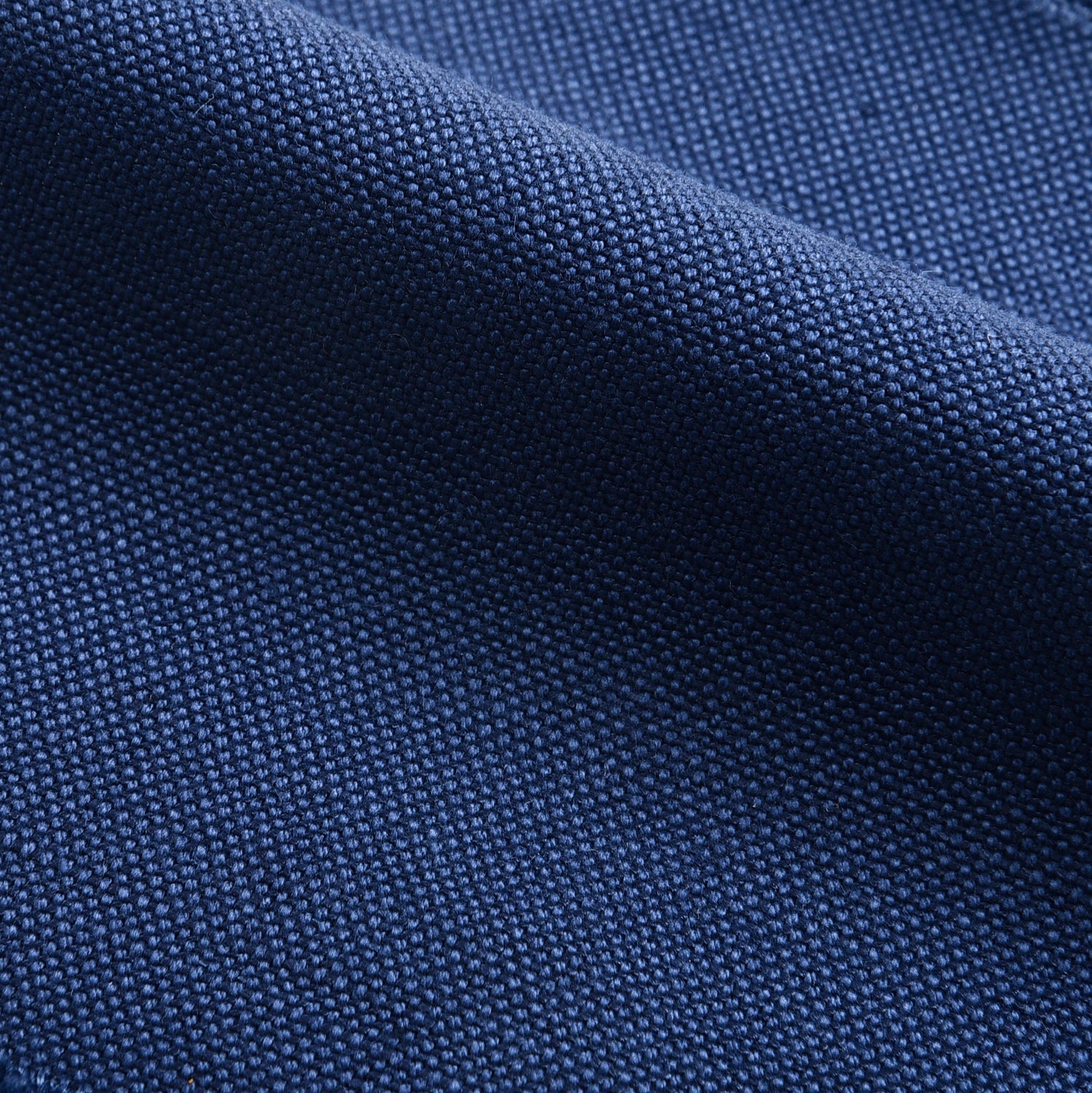 Close up view of custom linen canvas pants for men by Luxire in indigo blue