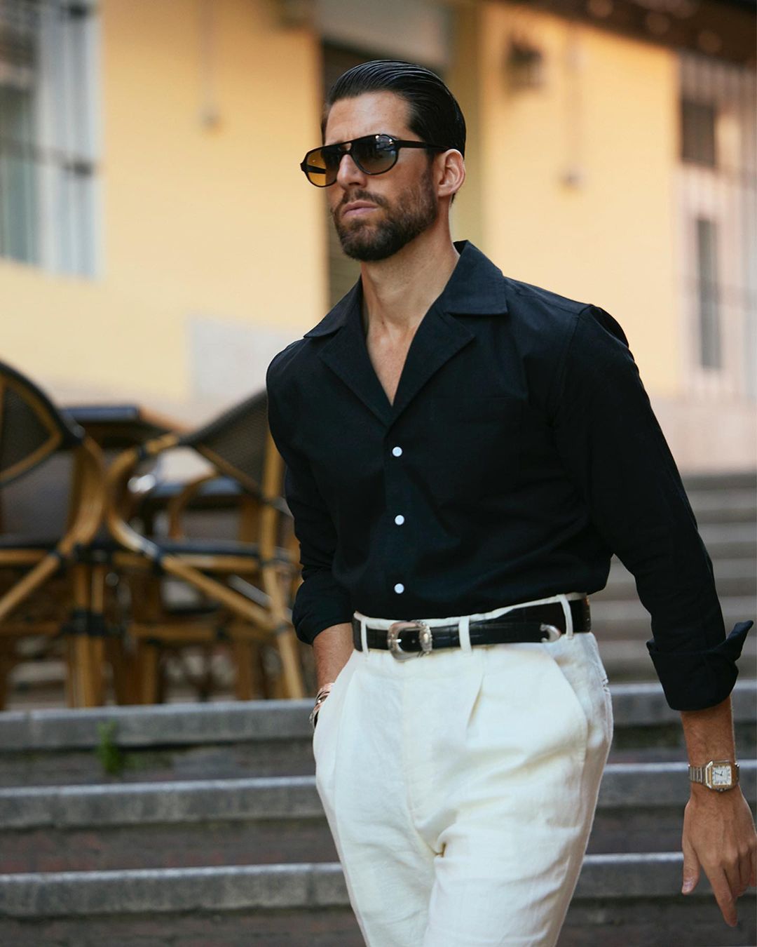 Male model wearing custom linen Gurkha pants for men by Luxire in cream wearing sunglasses