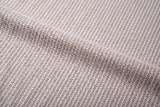 Close up of the custom oxford shirt for men by Luxire in pale orange