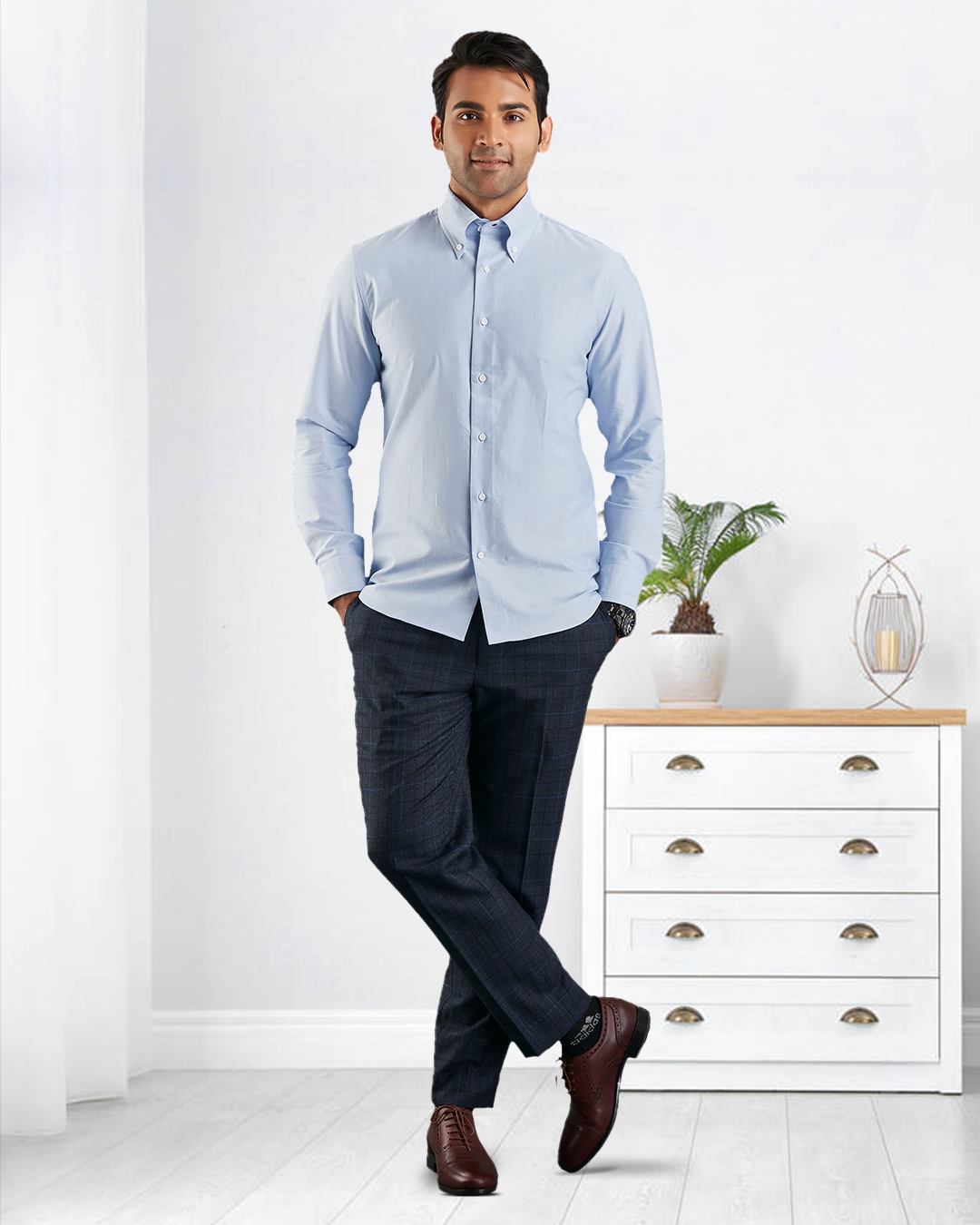 Model wearing the custom oxford shirt for men by Luxire in sky blue hands in pockets