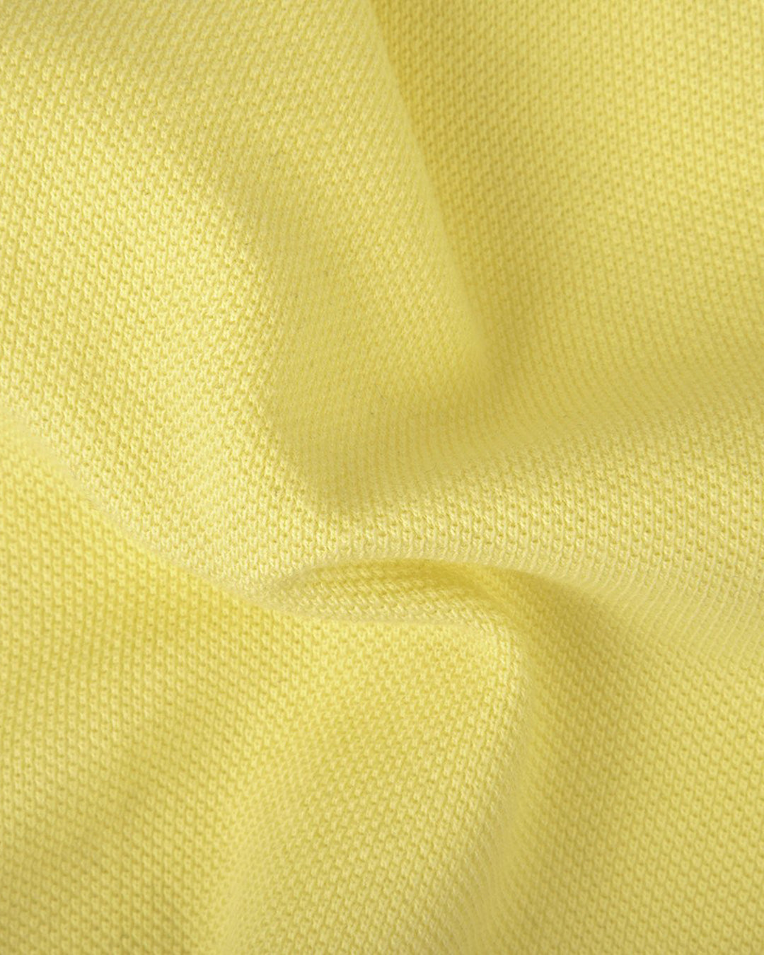 Close up fabric of the custom oxford polo shirt for men by Luxire in mid yellow