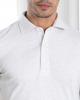 Close up of model wearing the custom oxford polo shirt for men by Luxire in ivory white