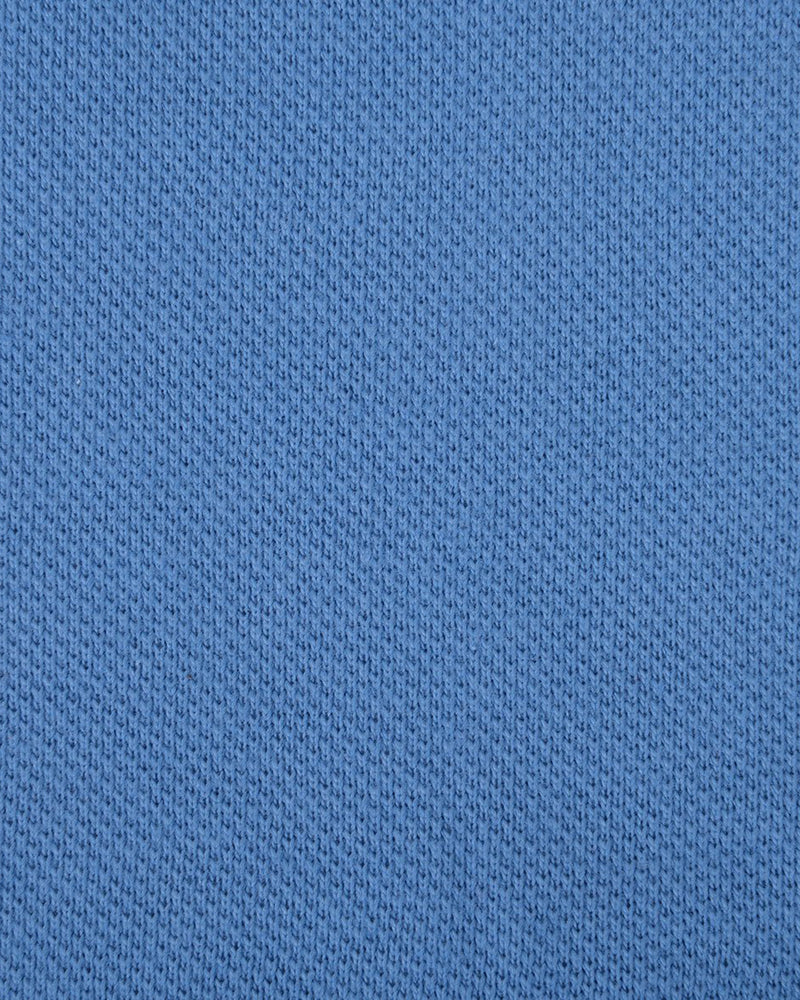 Close up of the custom oxford polo shirt for men by Luxire in steel blue 2