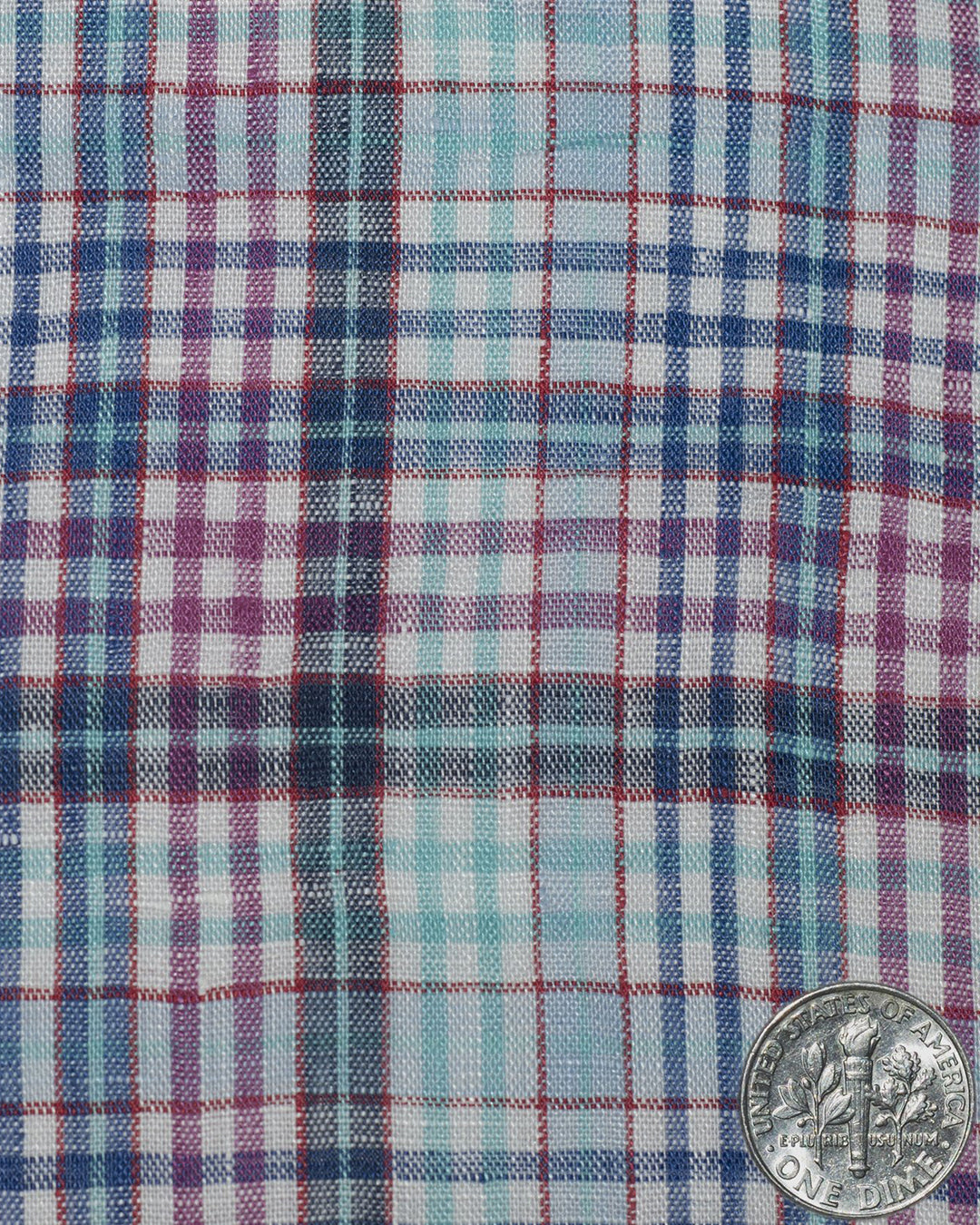 Close up view of custom linen shirt for men in blue pink aqua madras