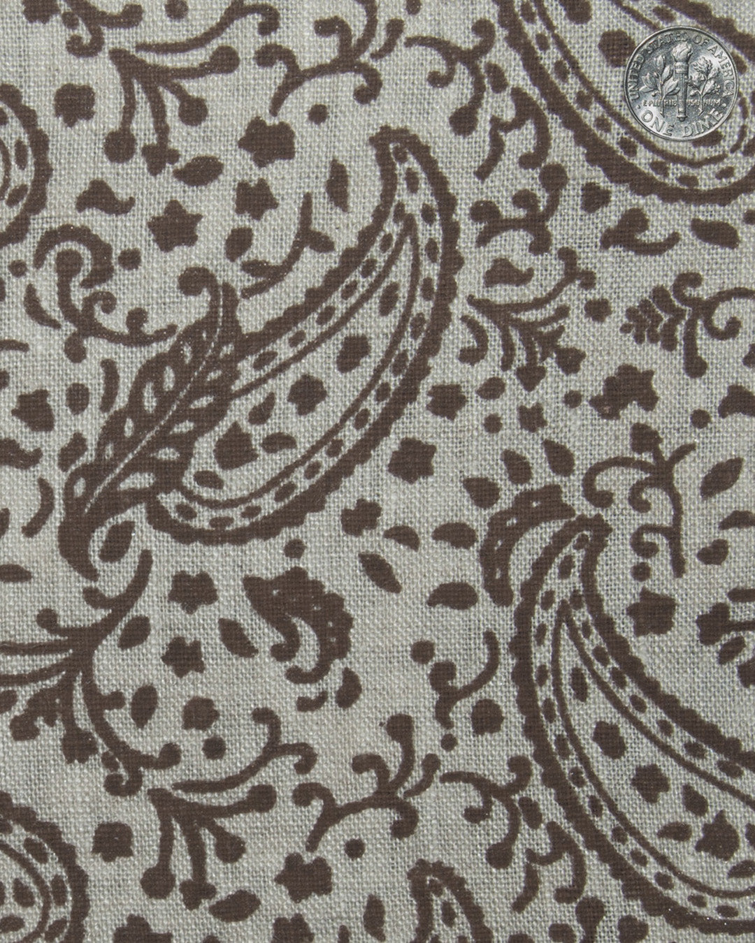 Close up view of custom linen shirt for men in brown printed paisley