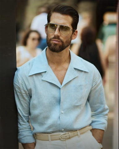 Model wearing the custom linen shirt for men in sky blue with collar by Luxire Clothing