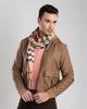 Model wearing the flannel shirt jacket for men by Luxire in sand with rib collar wearing a scarf