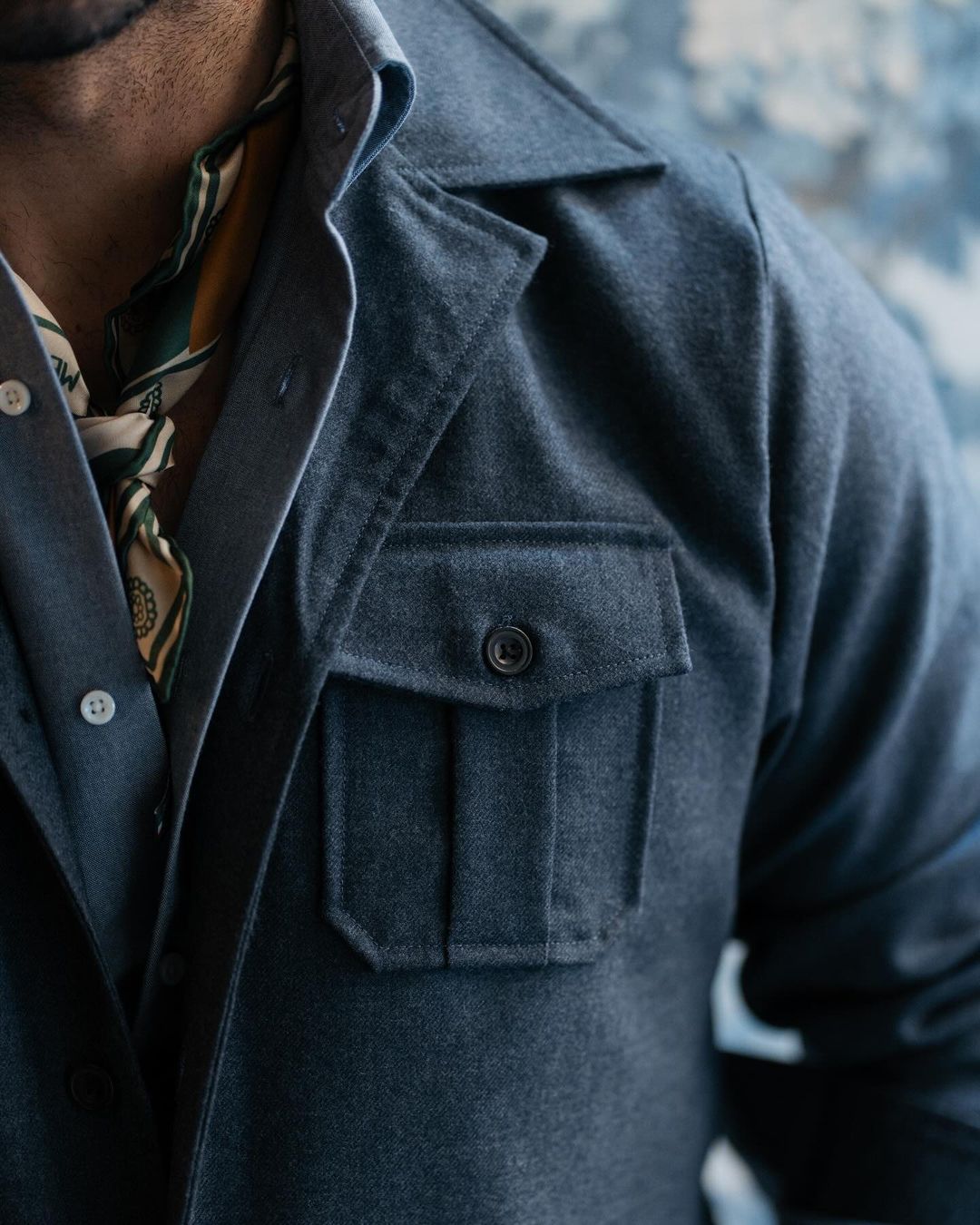 Close up of model wearing the wool flannel shirt jacket for men by Luxire in navy blue 2