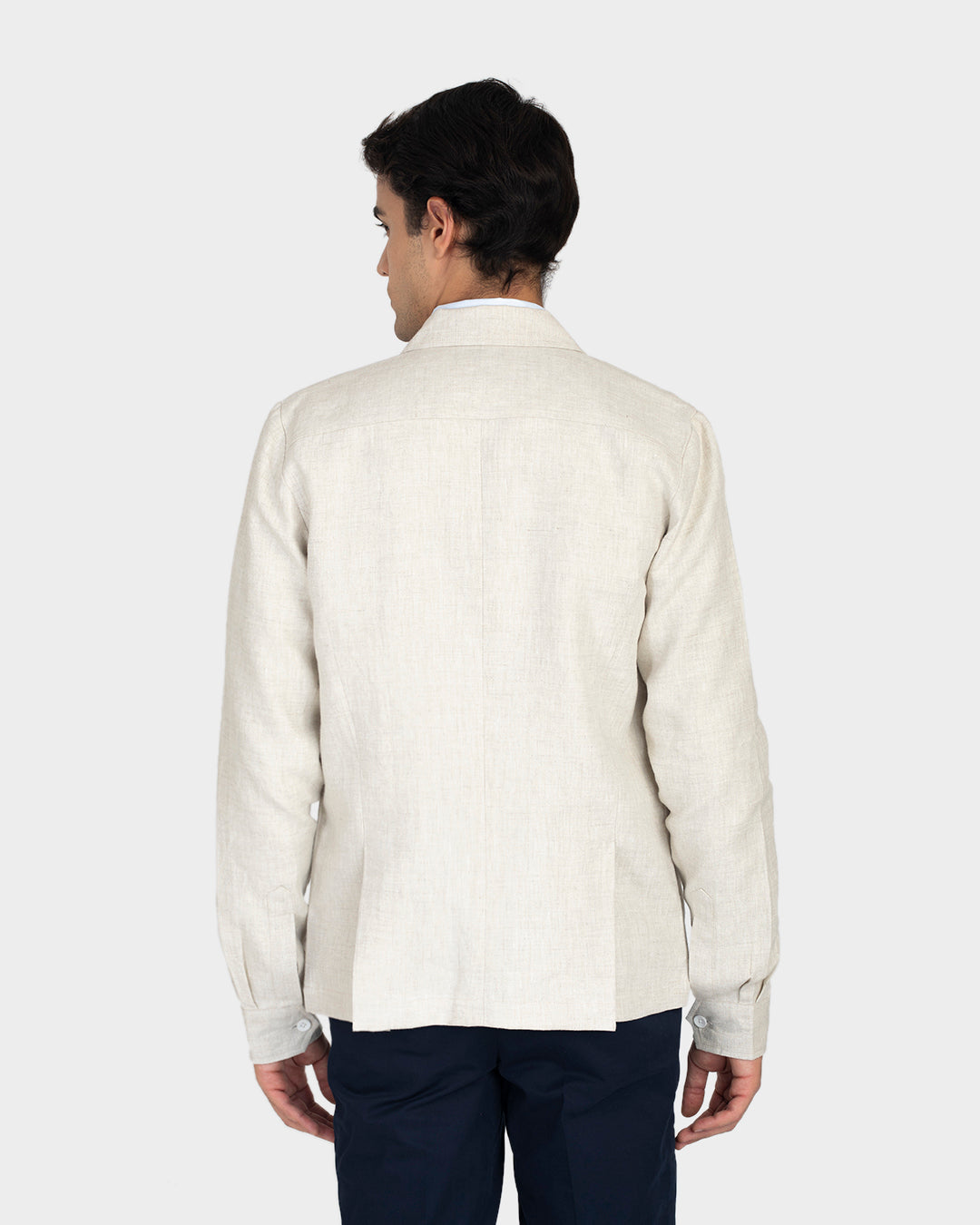 Back of model wearing the muslin shirt jacket for men by Luxire
